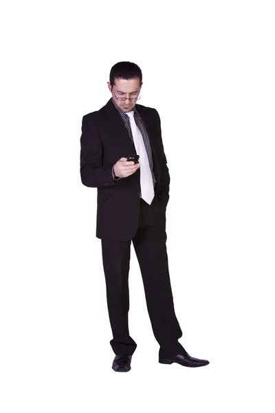 Biznesmen SMS-uje na komórkę — Zdjęcie stockowe