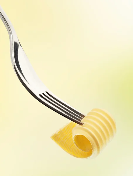 Ricciolo di burro su una forchetta — Foto Stock