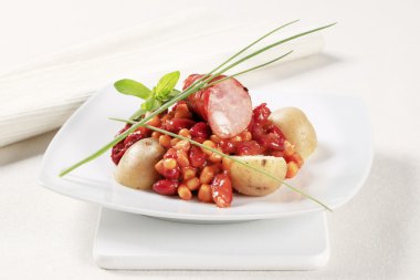 Bean and corn chili with sausage and potatoes clipart