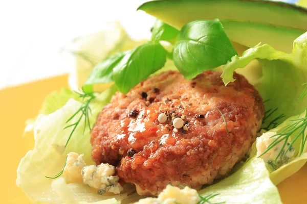 Meat patty on lettuce leaves — Stock Photo, Image