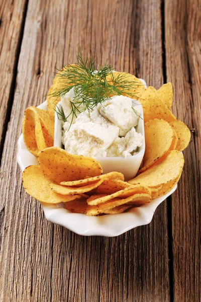 Corn chips and fresh cheese — Stock Photo, Image