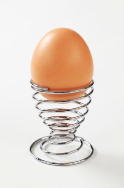 Egg in a modern egg cup clipart