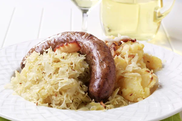 Blood sausage, sauerkraut and potatoes — Stock Photo, Image