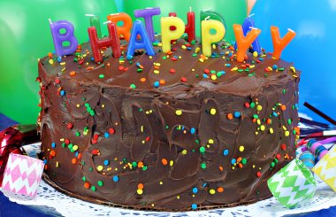 Chocolate cake with Happy Birthday candles. Selective focus on clipart