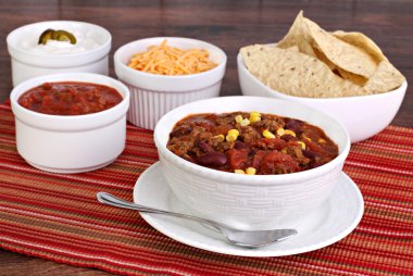 Taco Soup with assorted condiments clipart