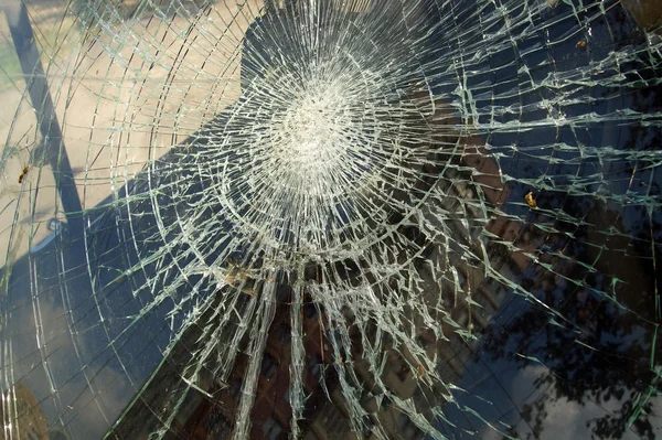 stock image A dirty broken window pane in black and white