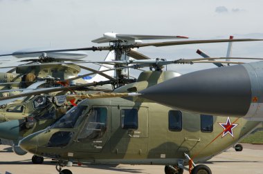 A number of modern military helicopters clipart