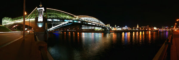 Moscow, Russia. Night. Panoramic view from the embankment of the Moskva River. Pedestrian bridge Bogdan Khmelnitsky
