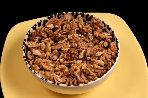 Closeup view of walnut purified on a black background — Stock Photo, Image