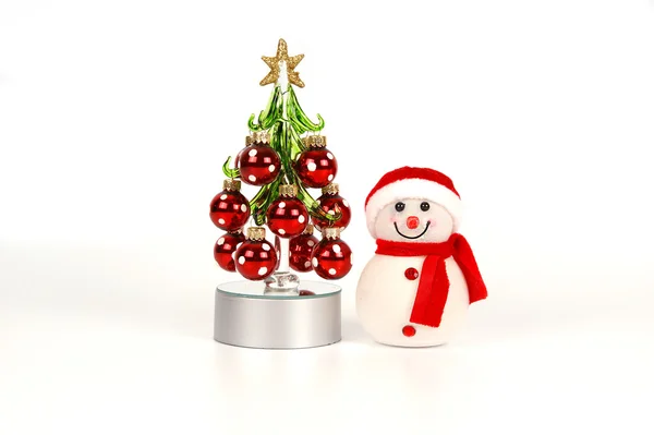 Brilhando de dentro de boneco de neve e árvore de Natal — Fotografia de Stock