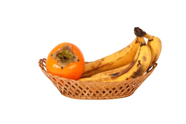Un bouquet de bananes et de kaki — Photo