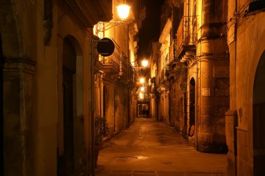 Ancient streets of Syracuse at night, Sicily, Italy clipart