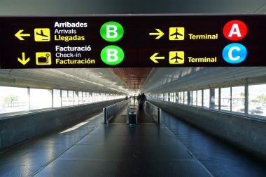 Directional sign in Barcelona International airport clipart