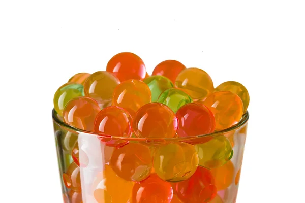 Bolas de colores en el vaso — Foto de Stock