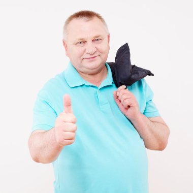 Senior man with jacket showing tump up clipart