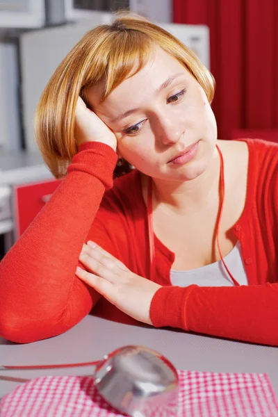 Wistful housewife in red — Stock Photo, Image