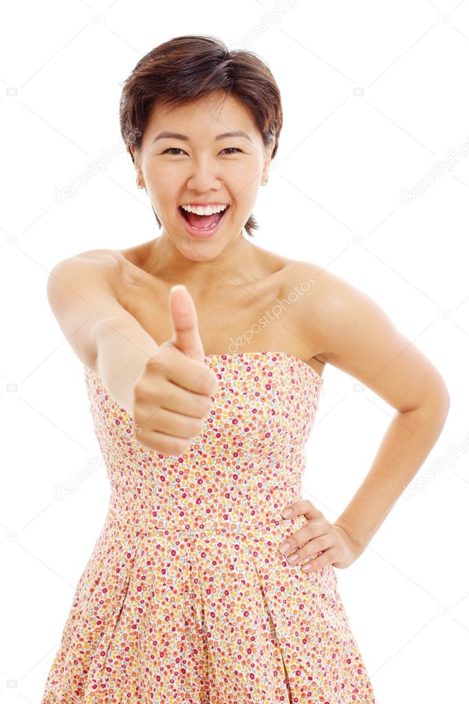 Pretty asian young woman shows thumb up