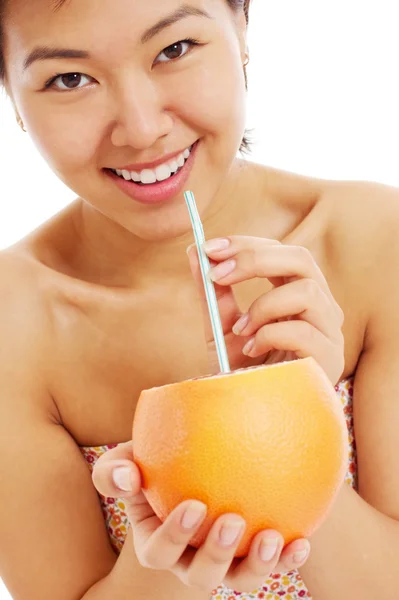 Pretty asian young woman with grapefruit — Stock Photo, Image