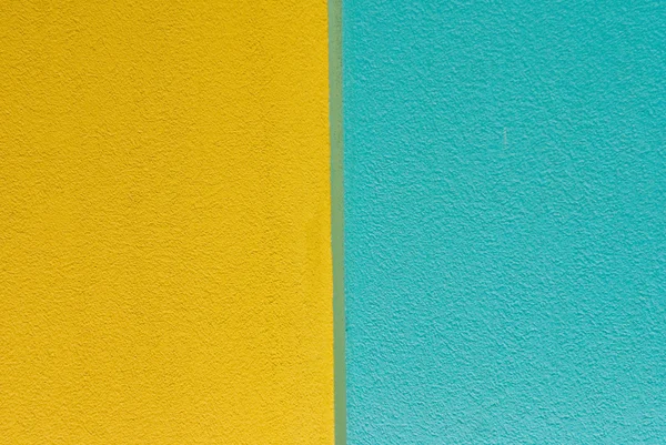 Žlutá a modrá zeď — Stock fotografie