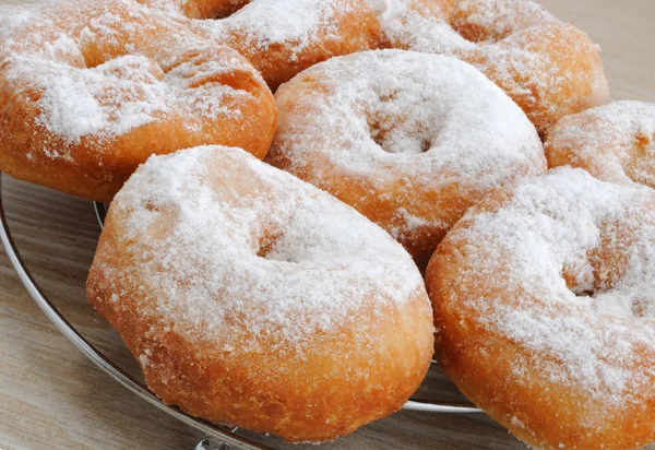 stock image Fried donuts in powdered sugar closeup