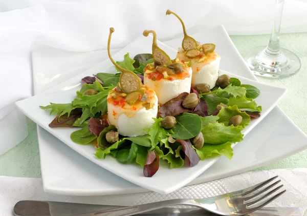 Cheese and capers sweet and sour sauce and pistachios — Stock Photo, Image