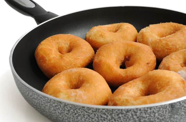 Donuts in a frying pan — Stock Photo, Image