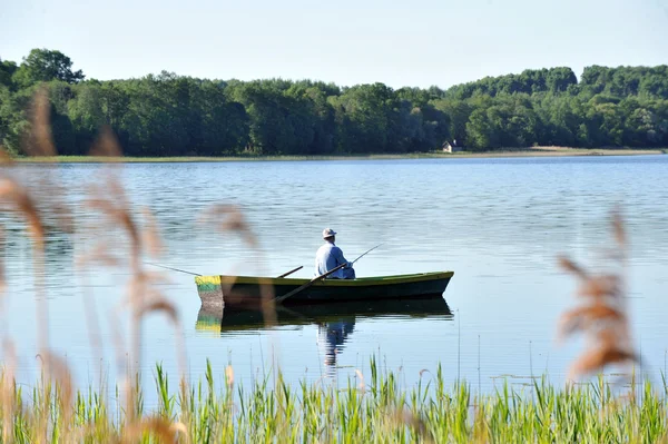 Fisherman in boat — Stock Photo, Image