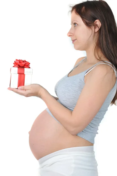 Donna incinta con regalo Foto Stock