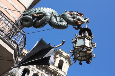 Dragon and umbrella of Casa Bruno Cuadros, Barcelona clipart