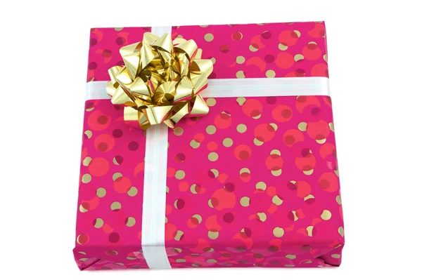 Подарунок: рожева коробка з золотим бантом — стокове фото