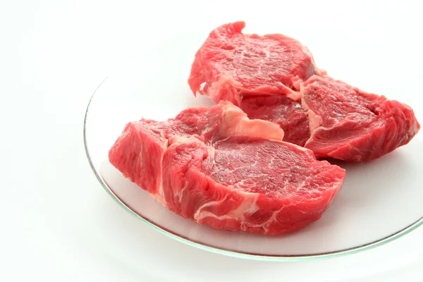 Raw meat on white — Stock Photo, Image