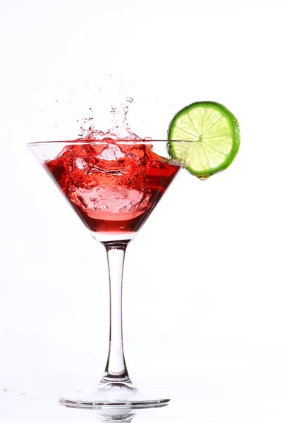 Red cocktail with lime on white — Stock Photo, Image