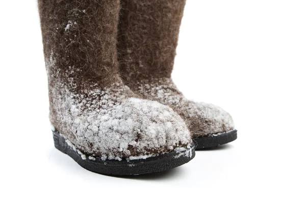Beyaz izole kar ile keçe çizmeler — Stok fotoğraf