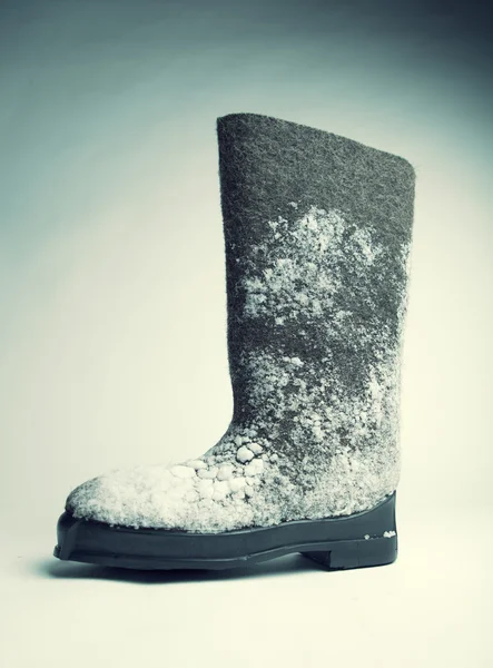 Cítil boty s izolované na bílém sněhu — Stock fotografie