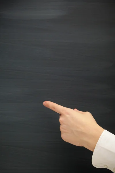 Forefinger point at the blank blackboard — Stock Photo, Image