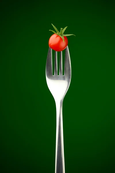 Tenedor con tomate cherry —  Fotos de Stock