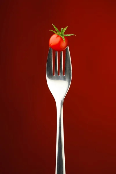 Fork with cherry tomato — Stock Photo, Image