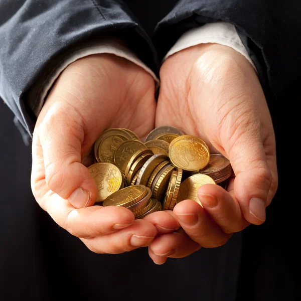 Hands holding coins — Stock Photo, Image