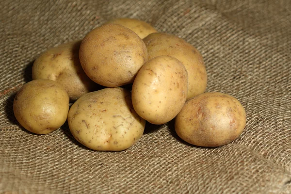 Potatoes on sacking — Stock Photo, Image