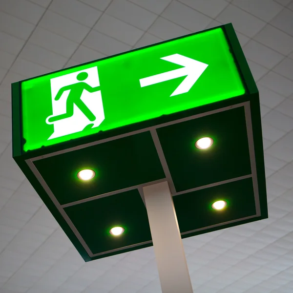 Green emergency exit sign — Stock Photo, Image