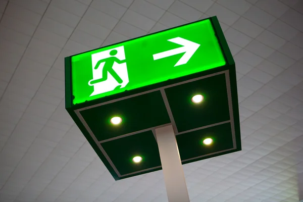 Green emergency exit sign — Stock Photo, Image