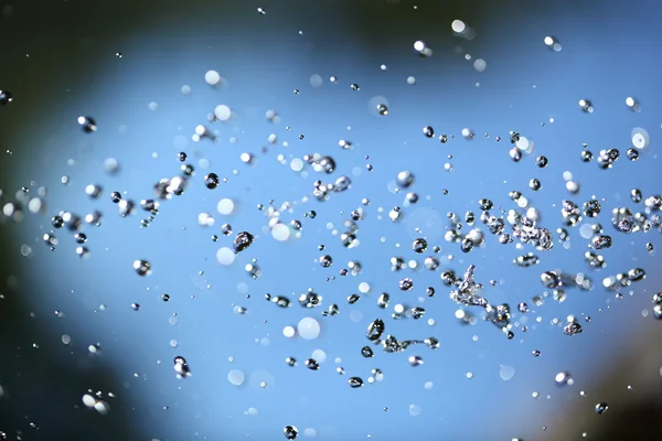 Σωματίδια των υδάτων στο μπλε — Φωτογραφία Αρχείου