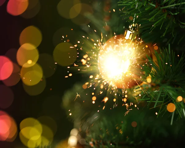 Christmas ornament with fireworks — Stock Photo, Image
