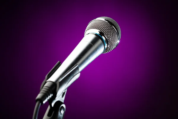 Microphone against the purple background — Stock Photo, Image