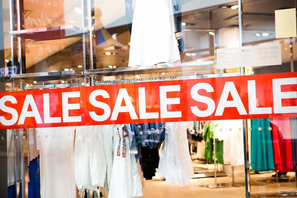 Sale title on the shop window — Stock Photo, Image