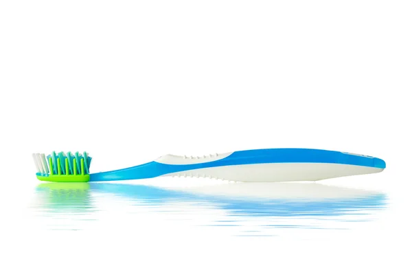 Toothbrush with water reflection — Stock Photo, Image