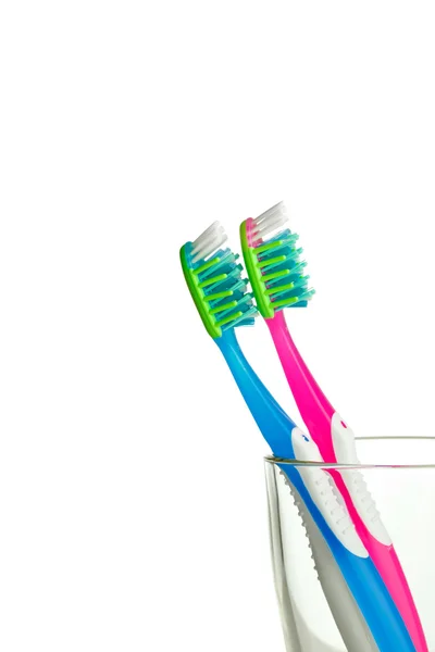 Two toothbrushes in the glass isolated — Stock Photo, Image