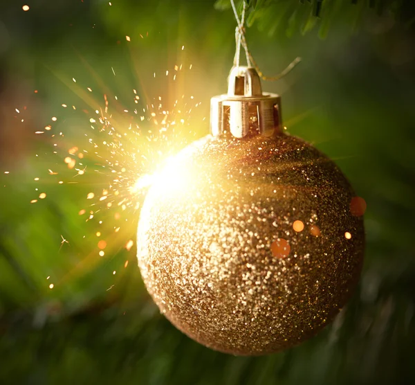Christmas ornament ball with shiny sparks — Stock Photo, Image