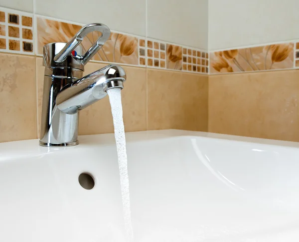 Mixer tap with running water — Stock Photo, Image