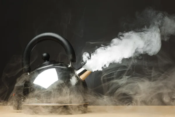 stock image Boiling kettle with dense steam